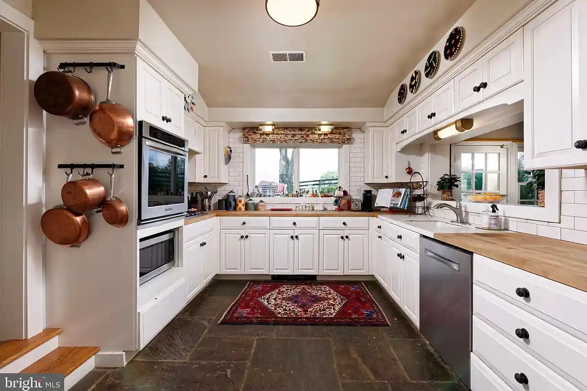 white farmhouse kitchen with flagstone flooring