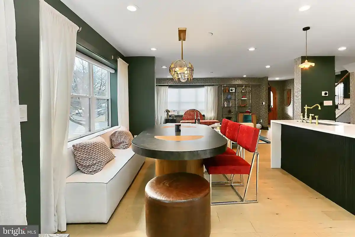 dining room with chandelier and mis-matched chairs
