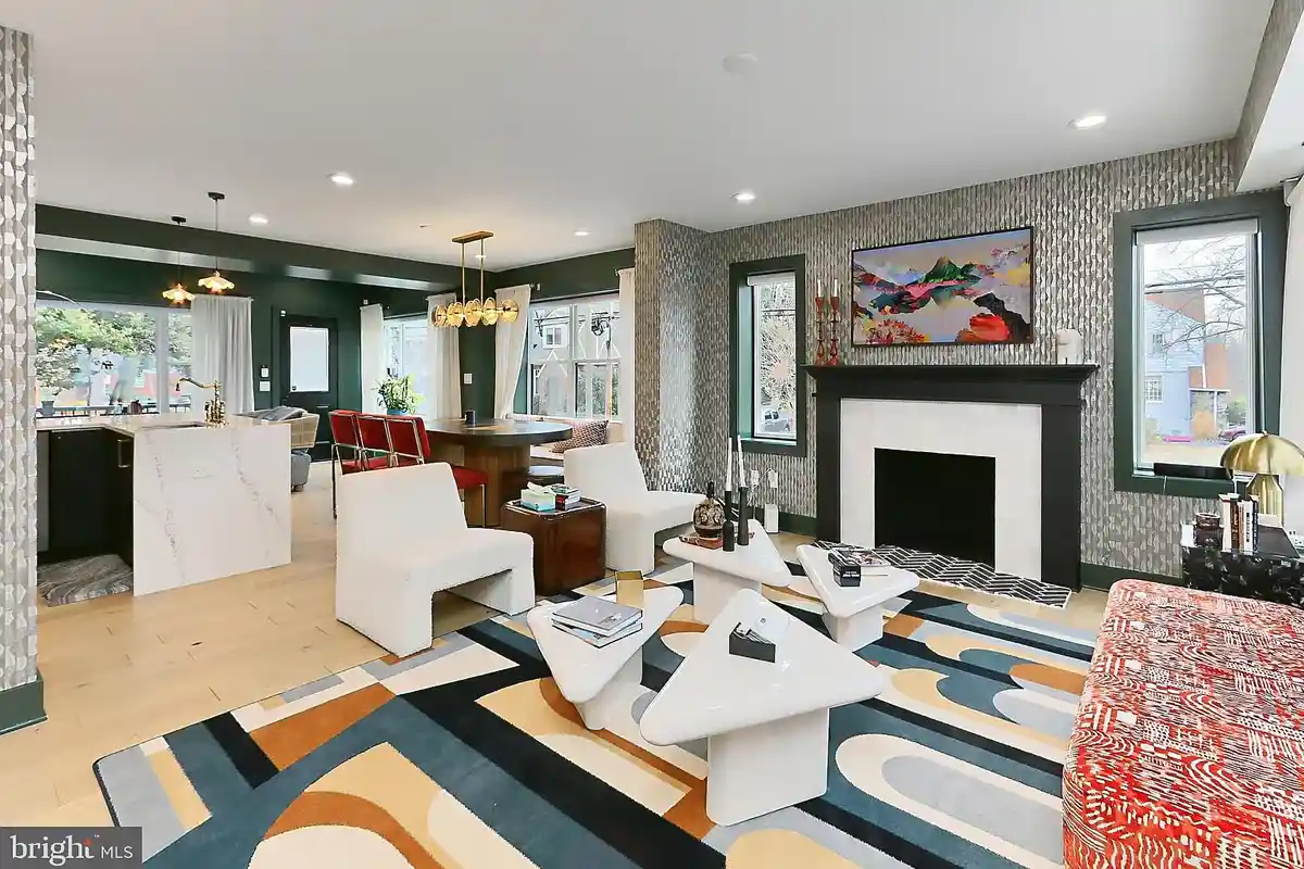 living room with wallpaper and wood fireplace