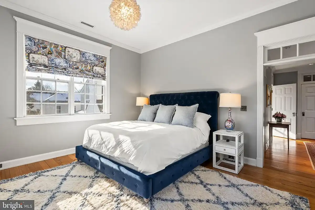 primary bedroom with dark blue bed frame