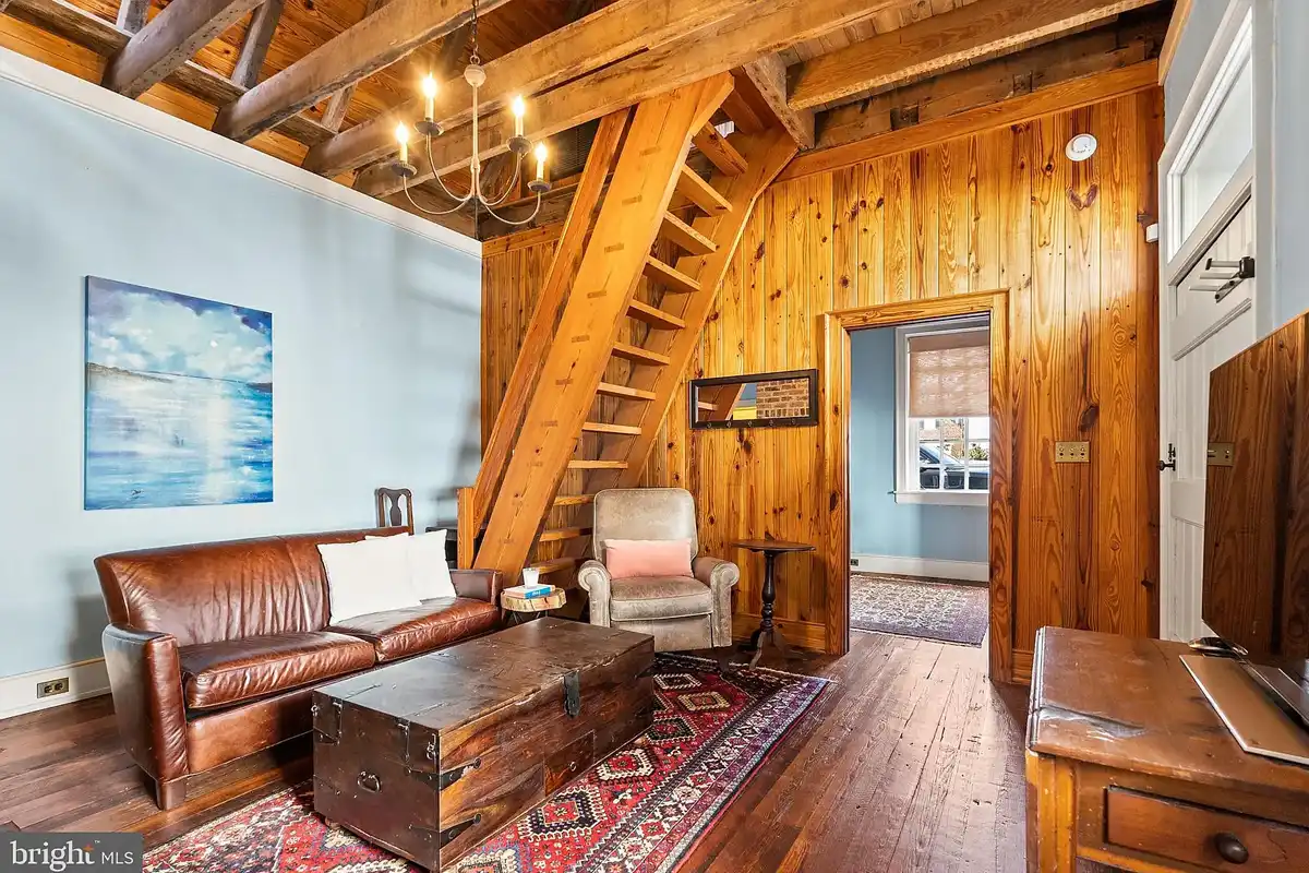 guest house with wood wall accent