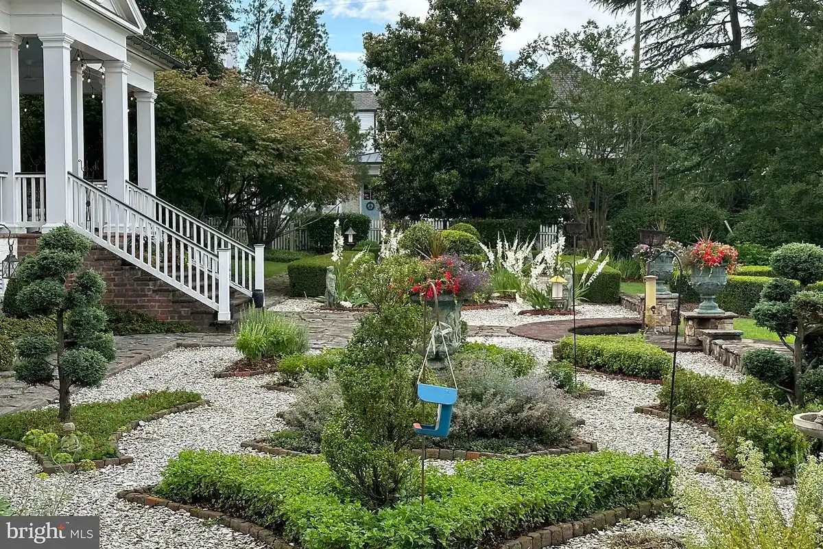 backyard with manicured garden and hardscaping