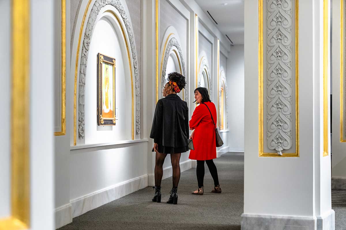 women looking at art exhibit