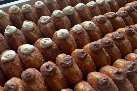 a tray of stuffed doughlab doughnuts