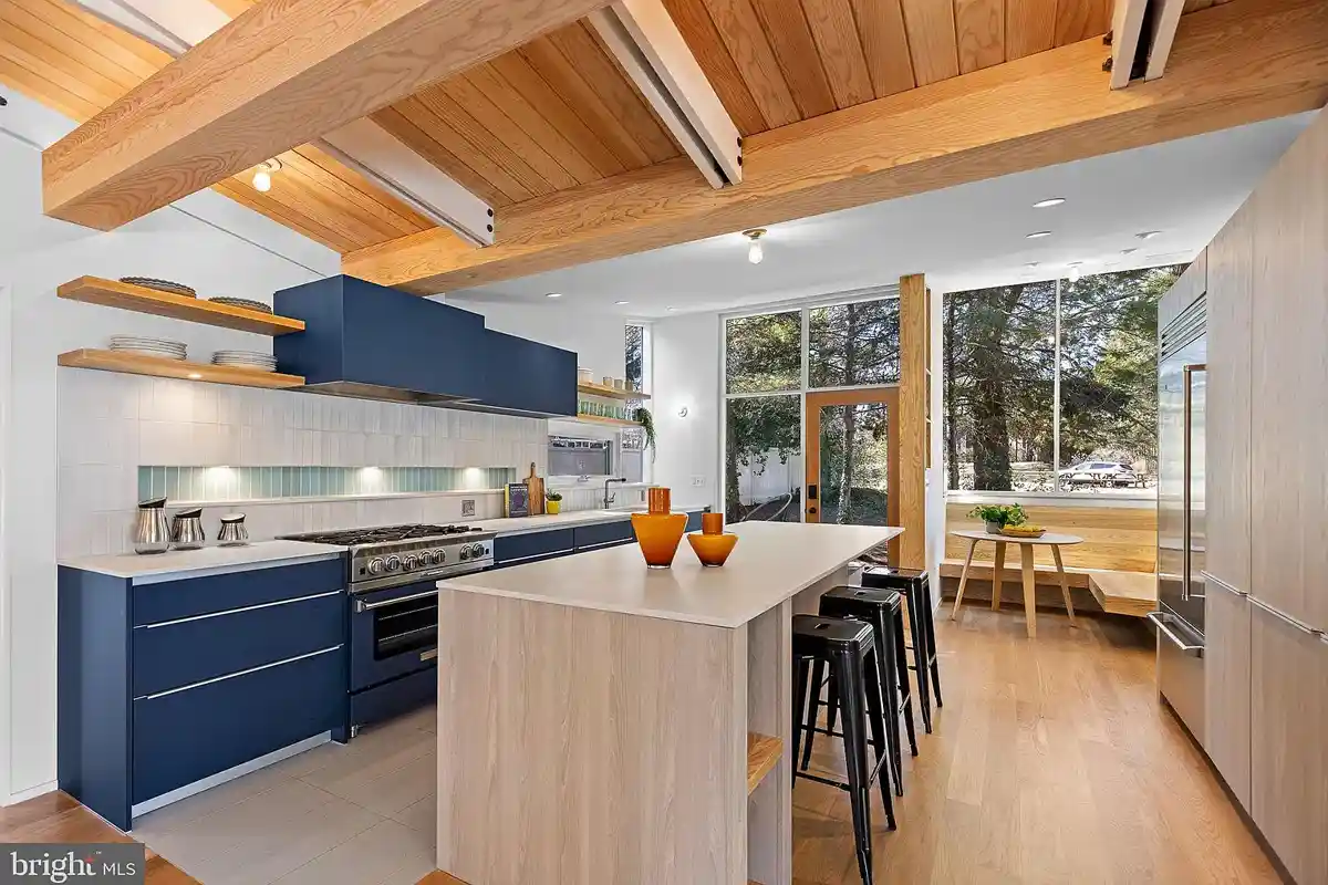 kitchen with center island and blue cabinets, open shelving