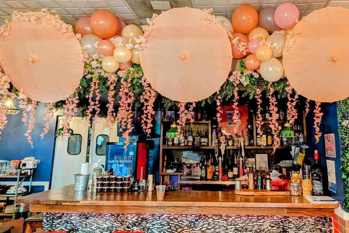 cherry blossom decorations and umbrellas at vienna thai & bar
