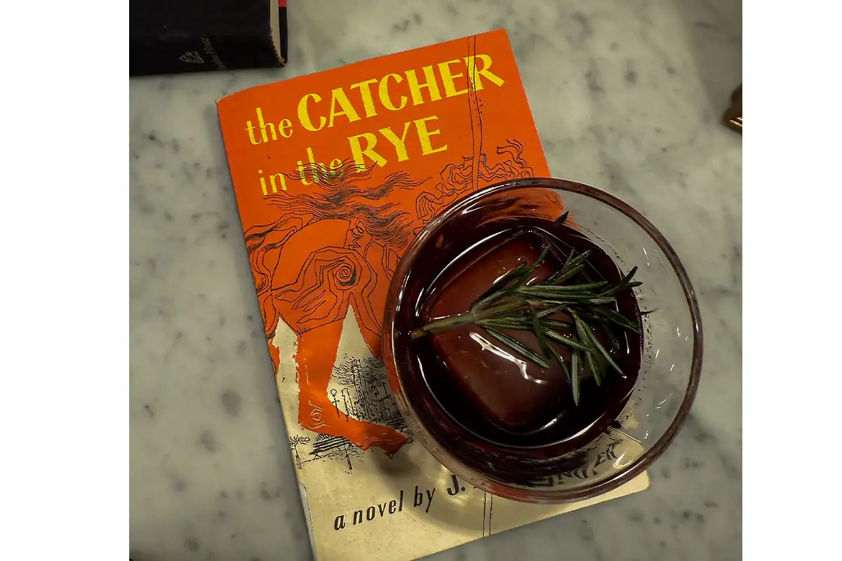 Cocktail and book at Banned Book Speakeasy returning to The Study at Morrison House