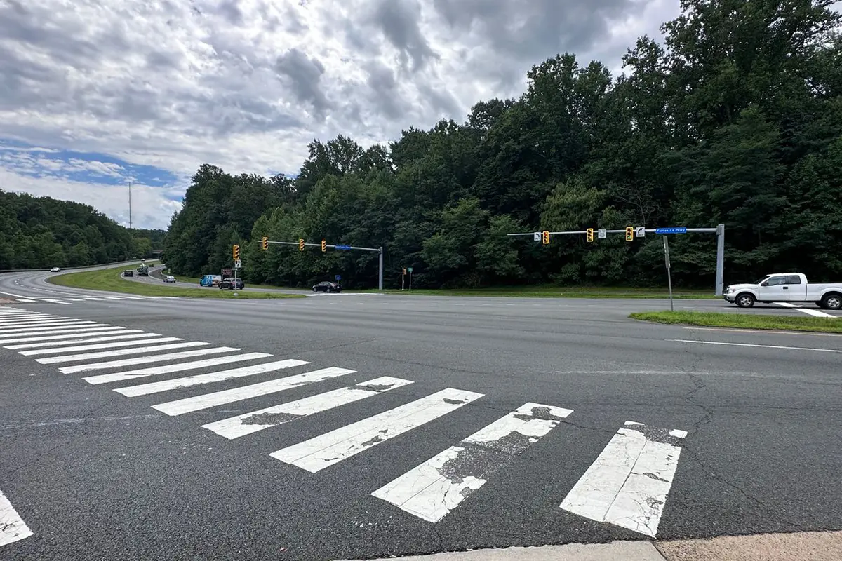 car on the road along the Fairfax County Parkway and Burke Center Parkway intersection