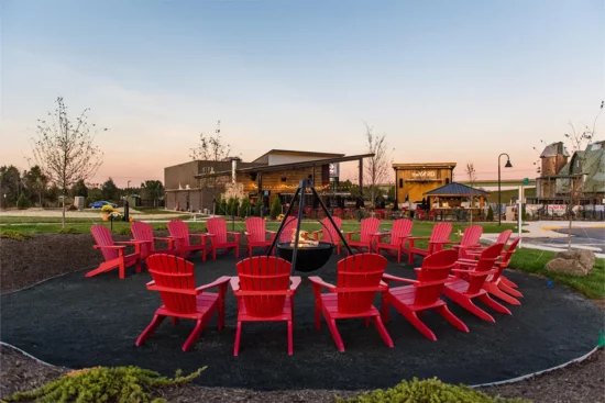 red chairs around an outdoor fire pit at 2Silos Brewing
