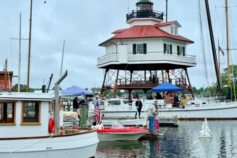 people launch a toy boat in the marina at Solomons Island, Maryland