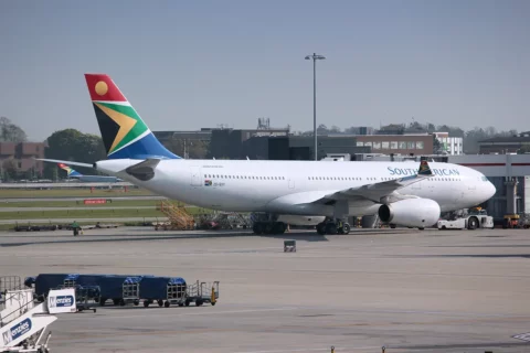 a South African Airline plane sits on an airport tarmac