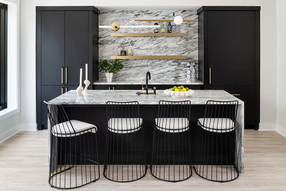 wet bar with marble island and backsplash