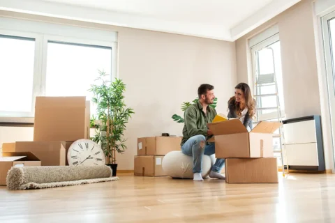a man and woman with packing boxes