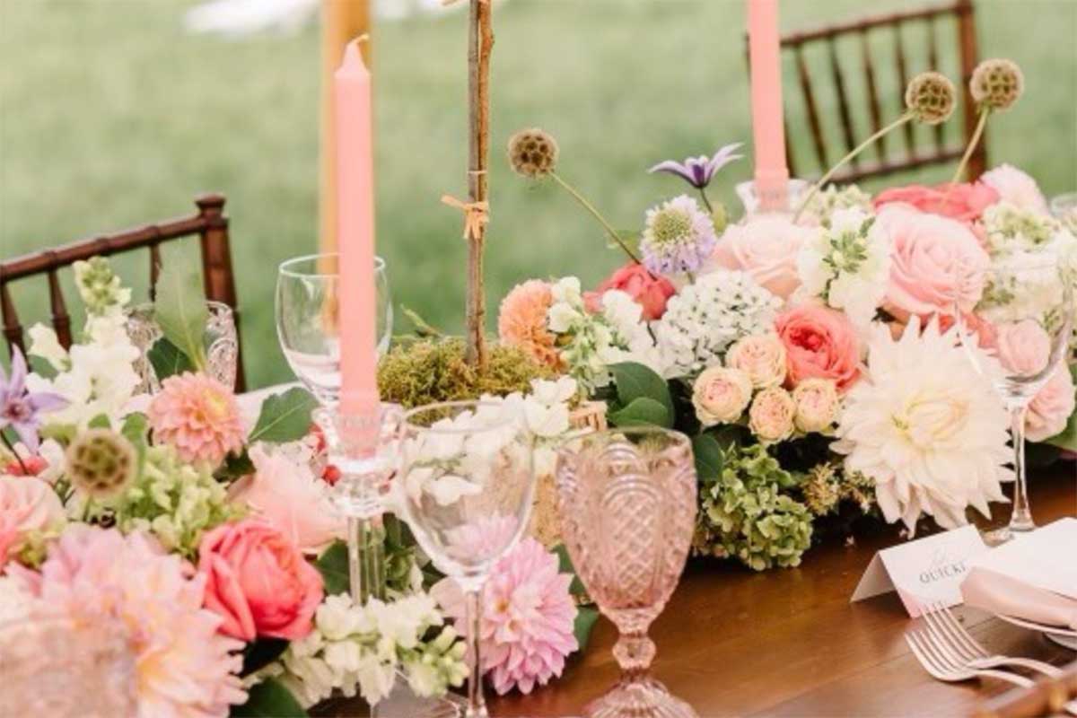 wedding table setting with pink accents