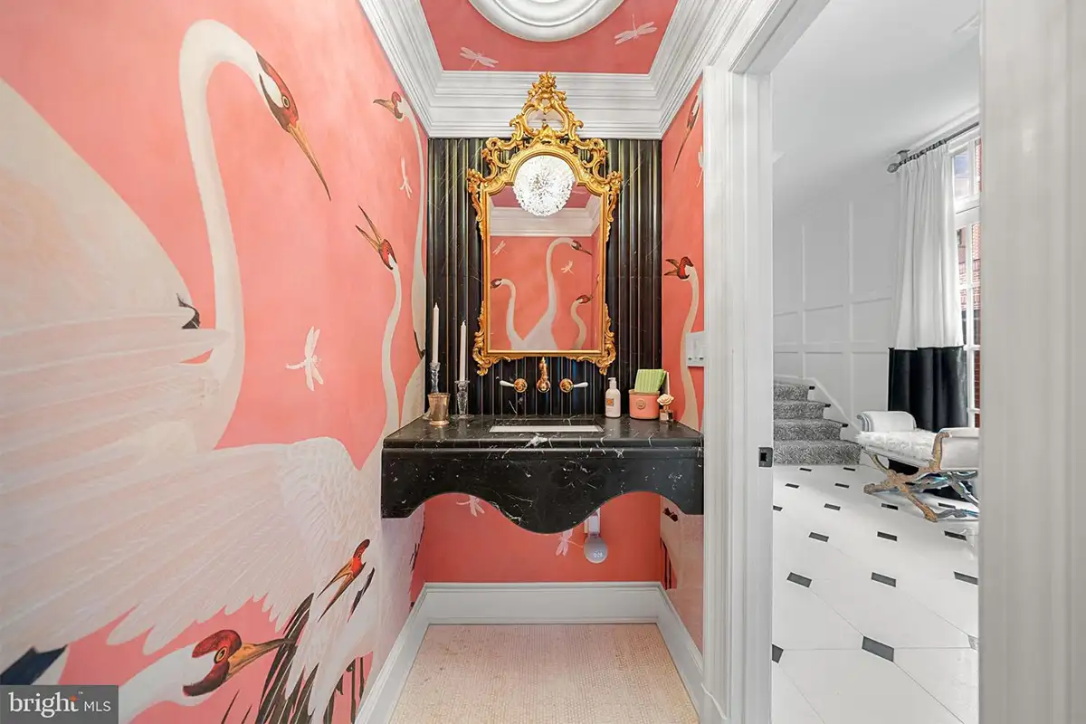 Powder room with Gucci wallpaper