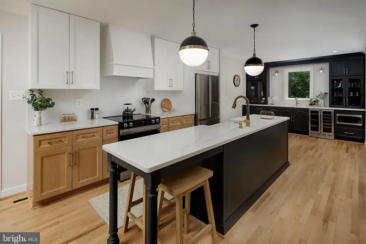 tri-colored kitchen with white, white oak, and charcoal cabinets