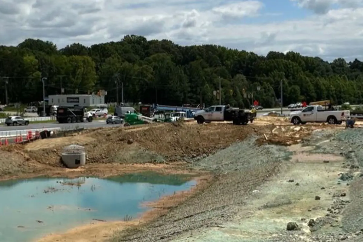 Construction crews work on the Fairfax County Parkway and Popes Head Road interchange