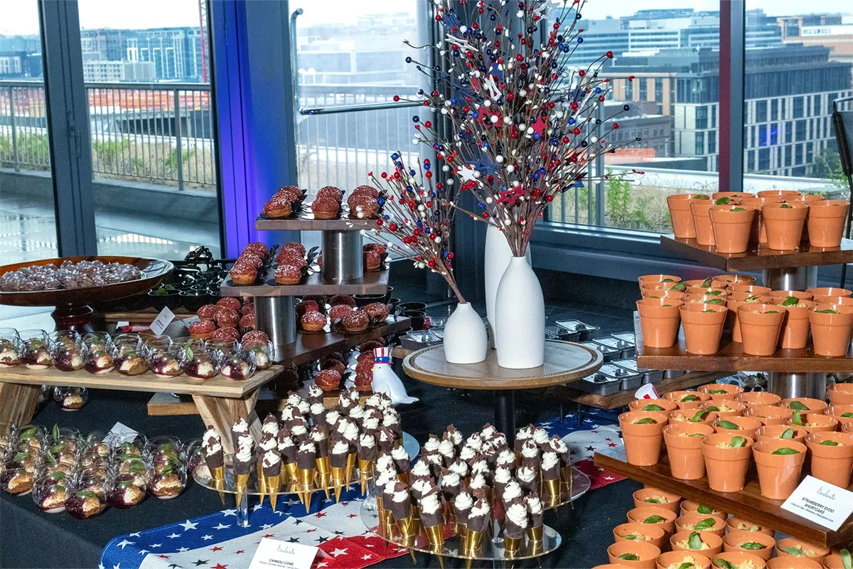 An assortment of pastries and desserts with red, white and blue decorations