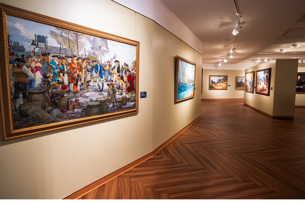 Art hangs on the walls of the National Museum of the Marine Corps as part of the 250th anniversary special exhibit