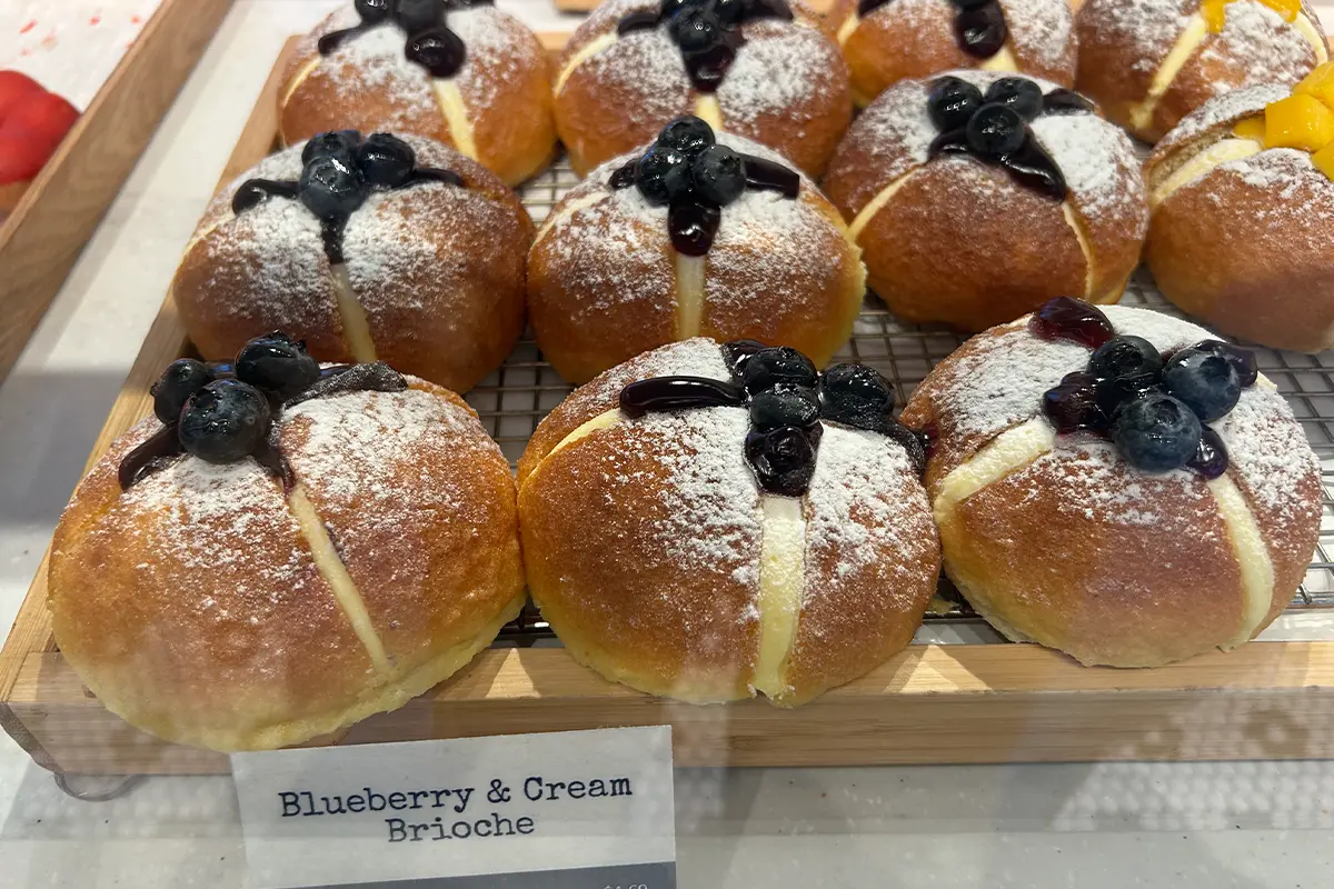 A tray of blueberry and cream brioche at Paris Baguette