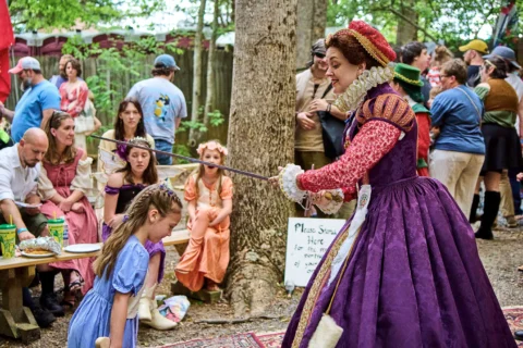 People in Renaissance Faire costumes at the Virginia Renaissance Faire