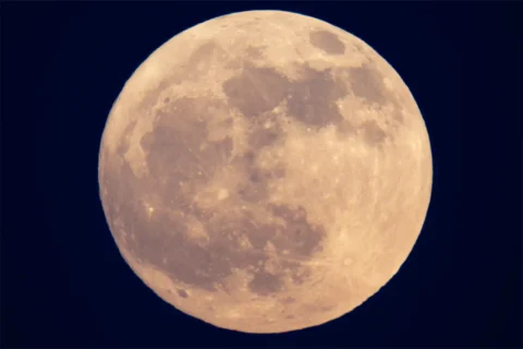 a full strawberry moon in the sky