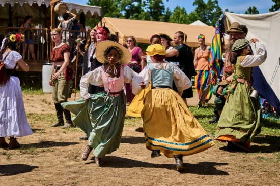 people in costumes dance at the Virginia Renaissance Faire