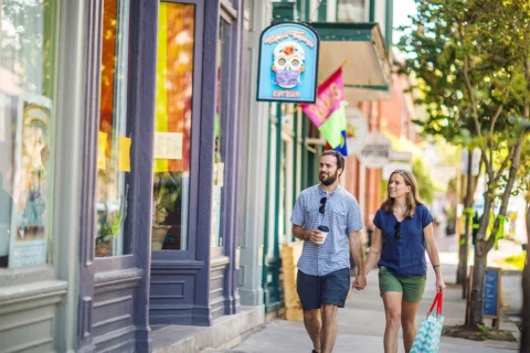 A couple walks down the sidewalk in Shepherdstown, WV