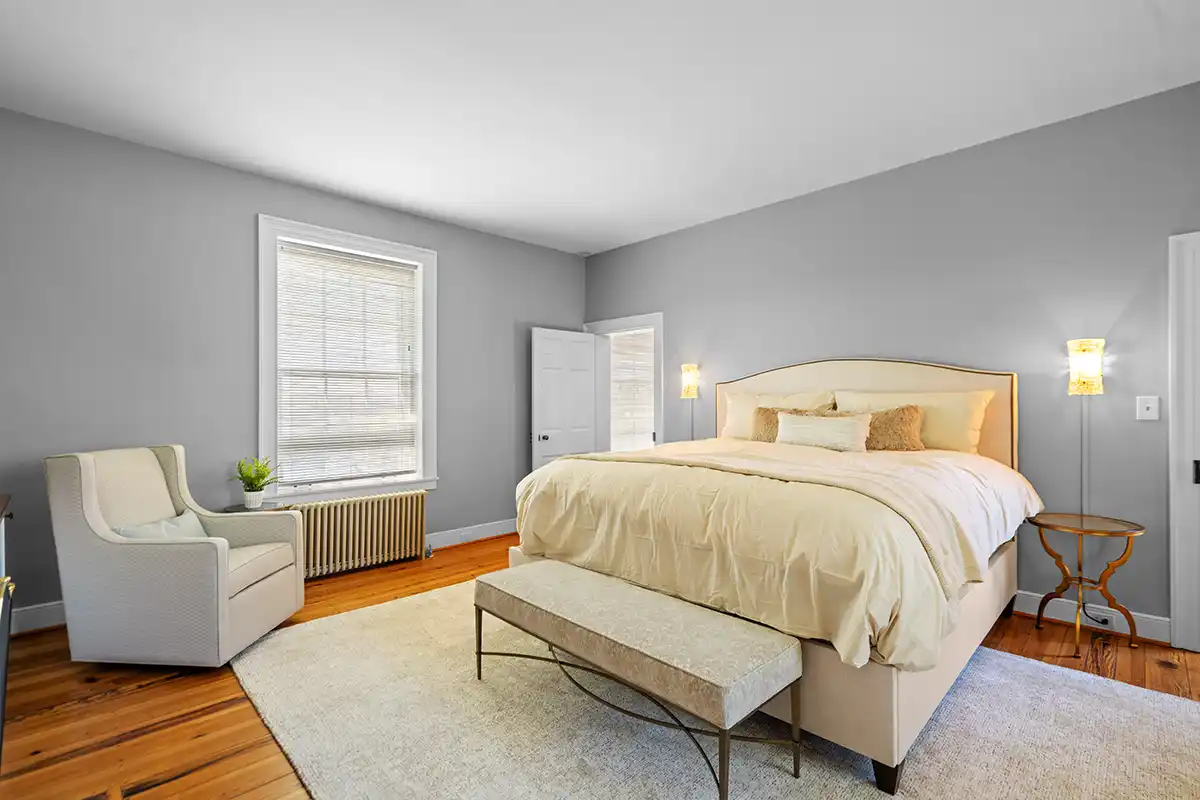 primary bedroom with bed and sitting area