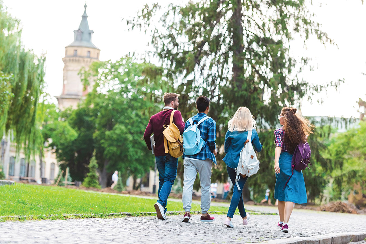 group of students walking on college campus