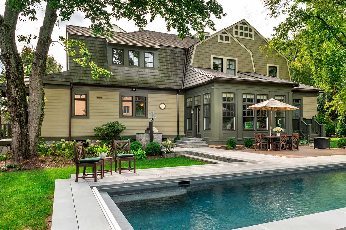 backyard showcasing in-ground pool and exterior of home