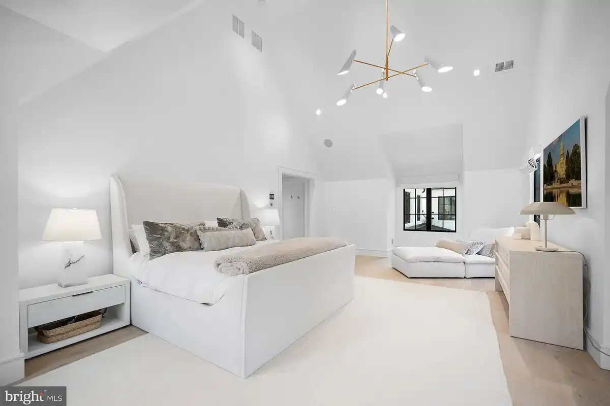 all-white owners suite bedroom