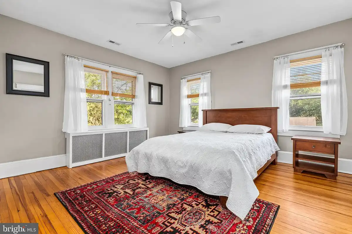 primary bedroom with original oak flooring