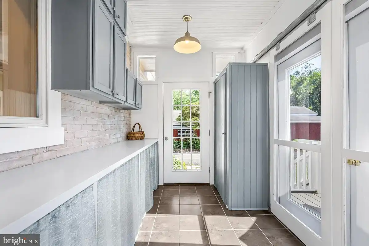 bonus room with built-in cabinets and access to deck