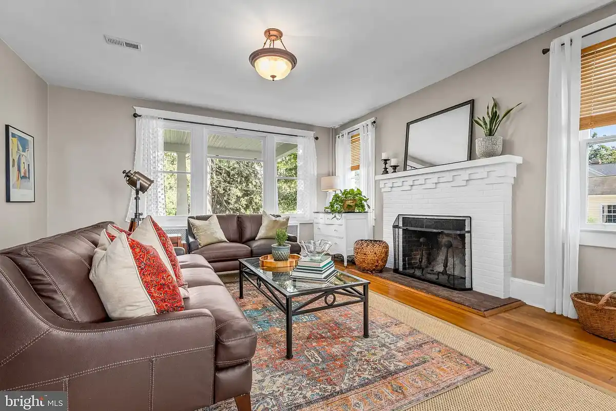 formal living room with white brick fireplace