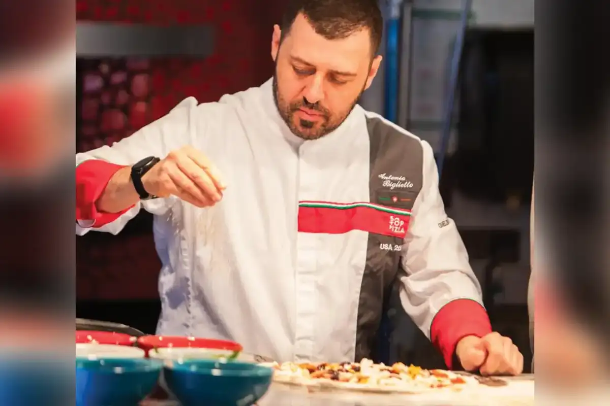 Rosario Farruggio prepares a pizza at A Modo Mio