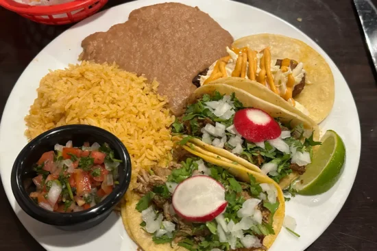 a plate of rice, beans and tacos at Casa de Avila