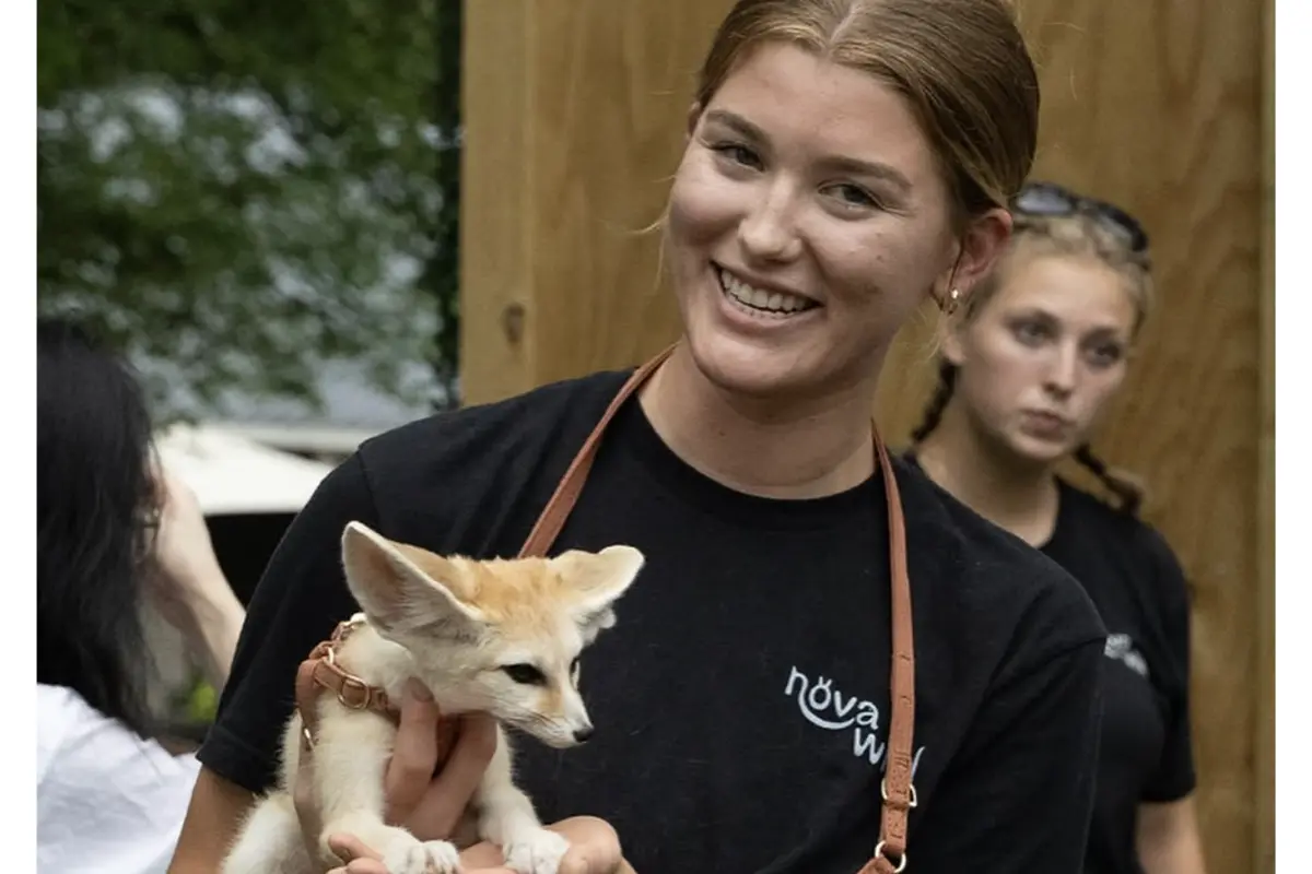 A NOVA Wild Zoo staffer holds an animal