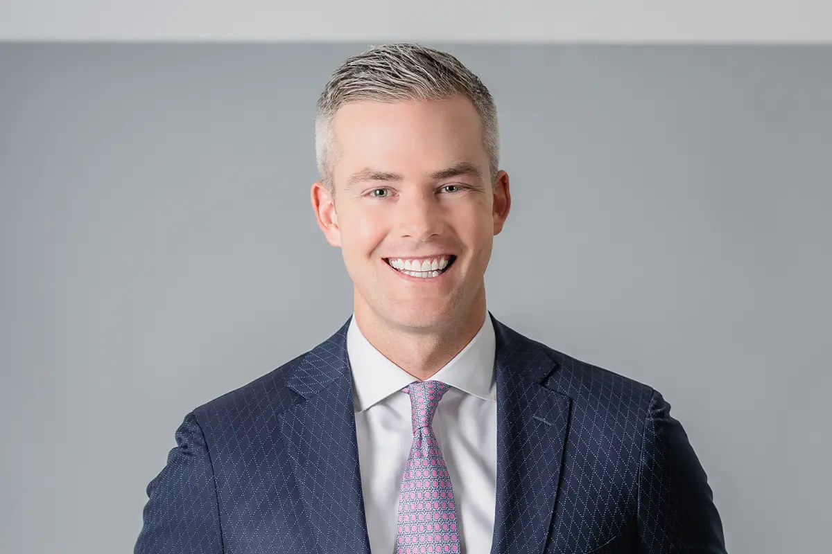 headshot of Ryan Serhant in a suit