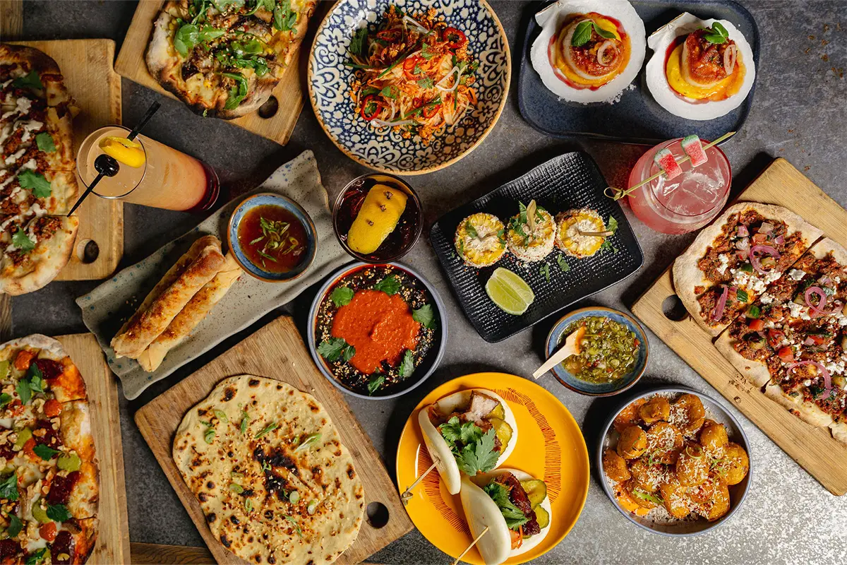 a table full of plates of food at Palette 22