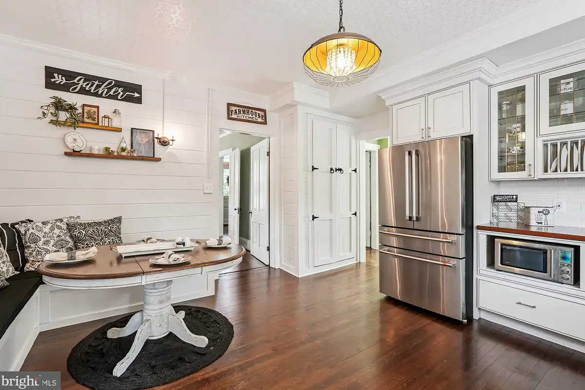 Kitchen with paneled walls, banquette seating