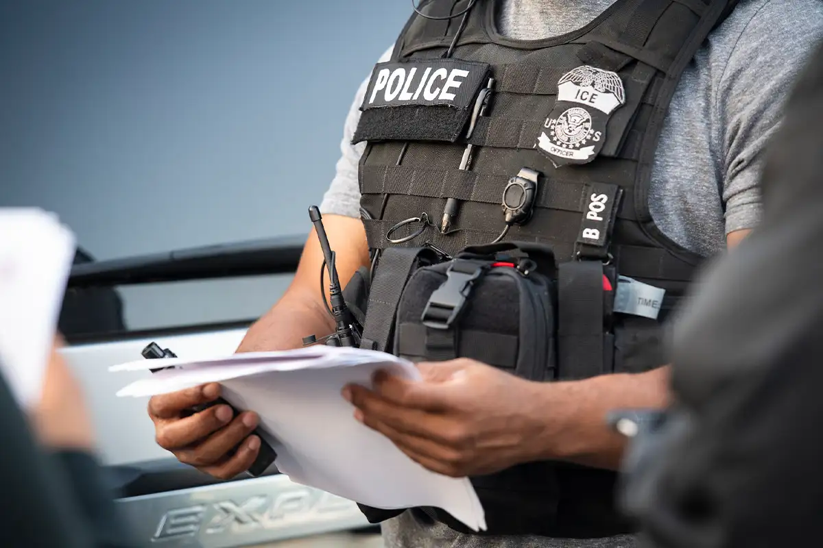 Immigration and Customs officer with paperwork