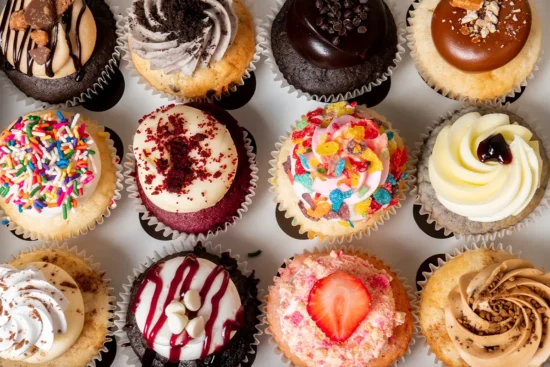 a selection of colorful cupcakes
