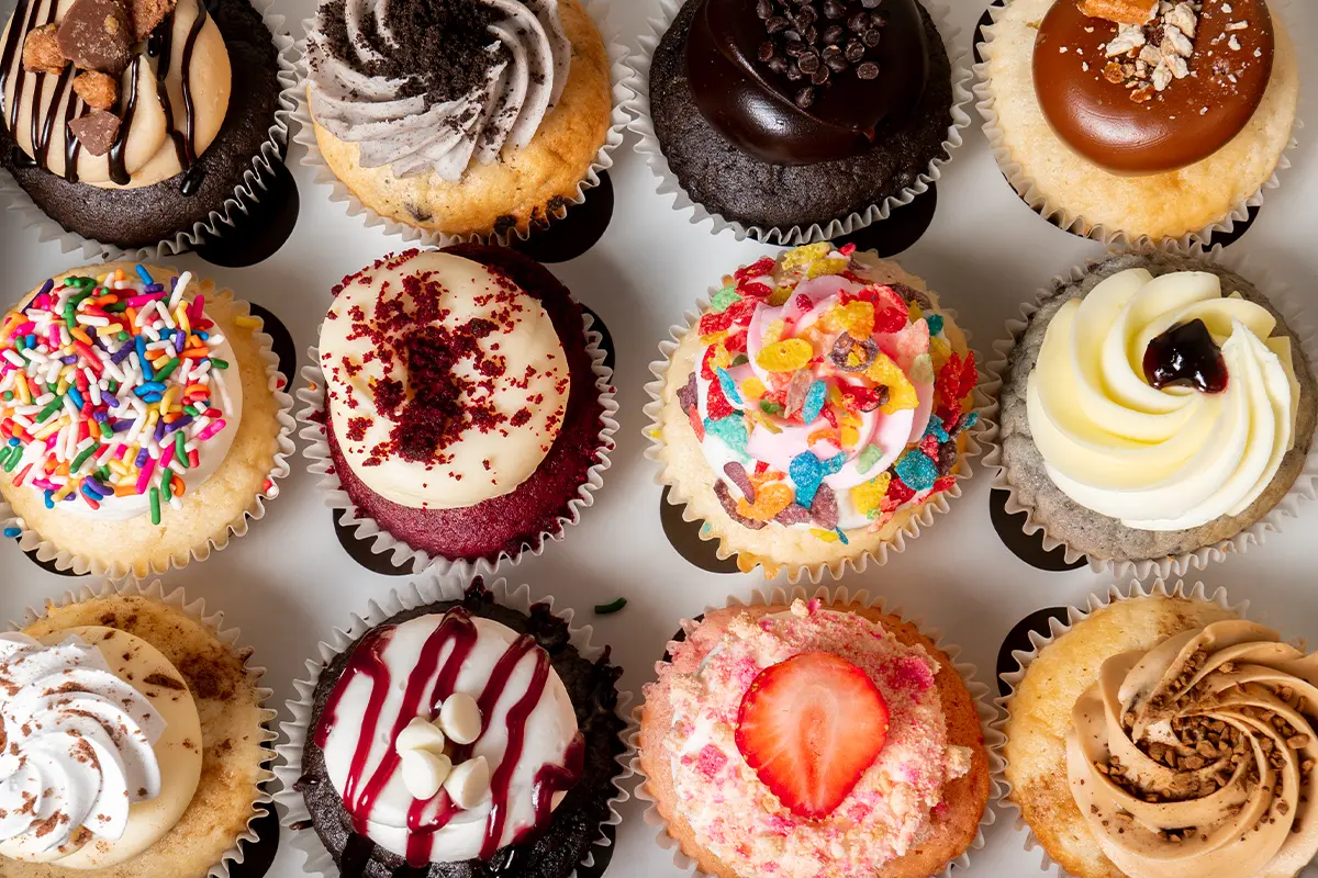 a selection of colorful cupcakes