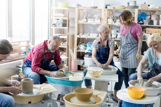 adults in a pottery class