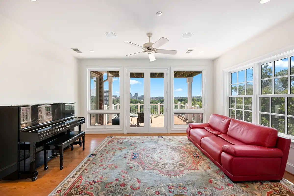 Music room with a piano and city views