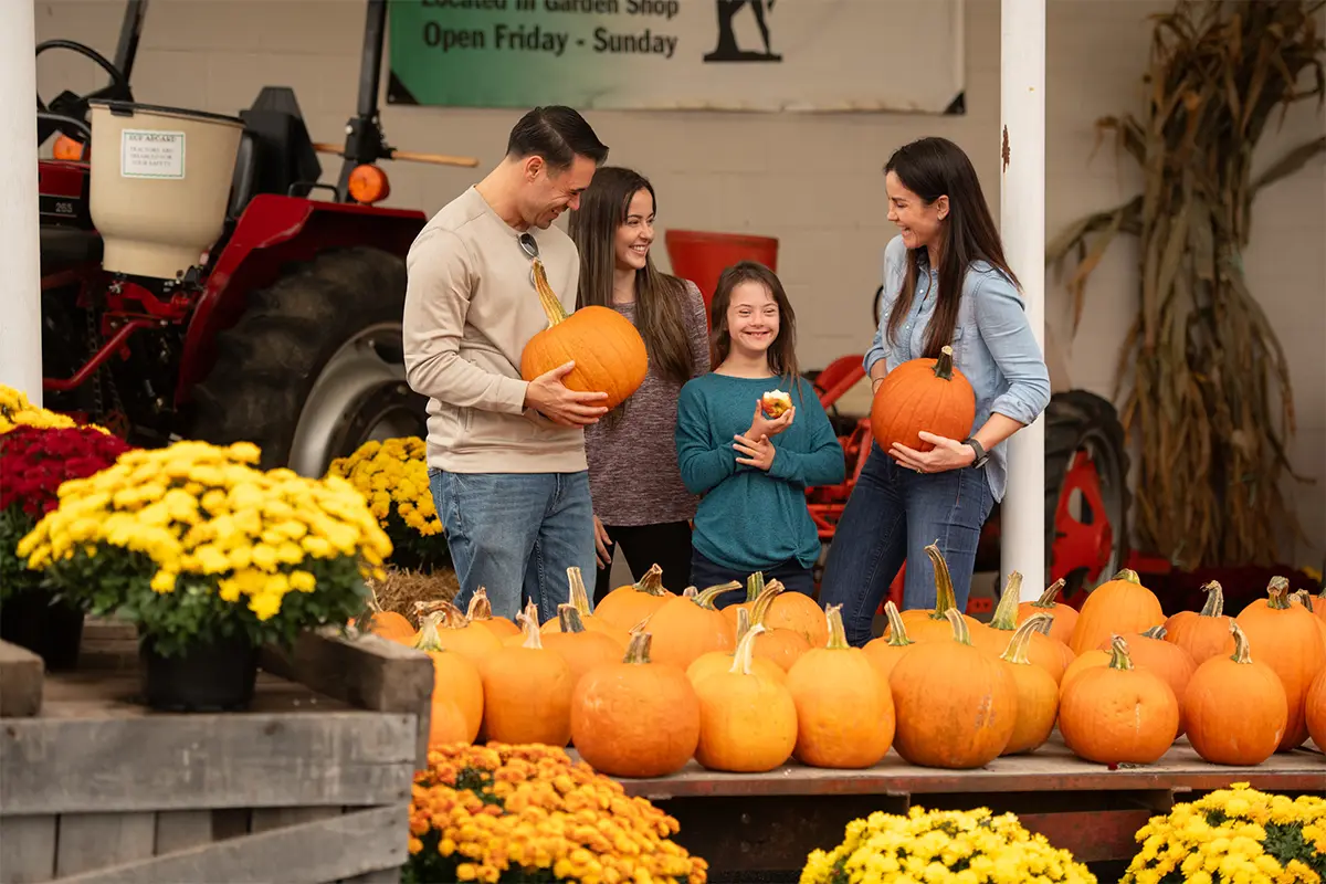 a family at a pumpkin stand in Gettysburg, PA
