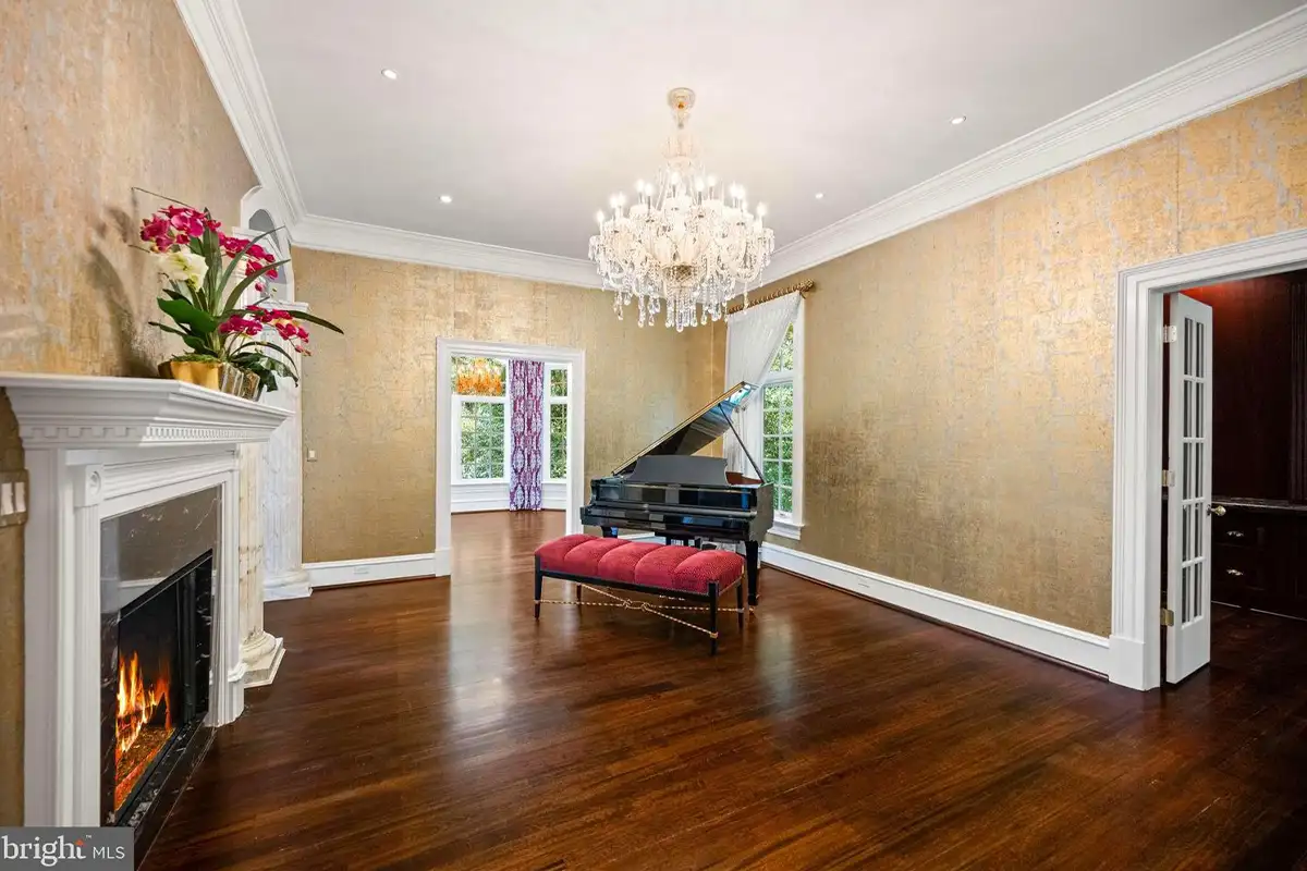 Room with fireplace and piano