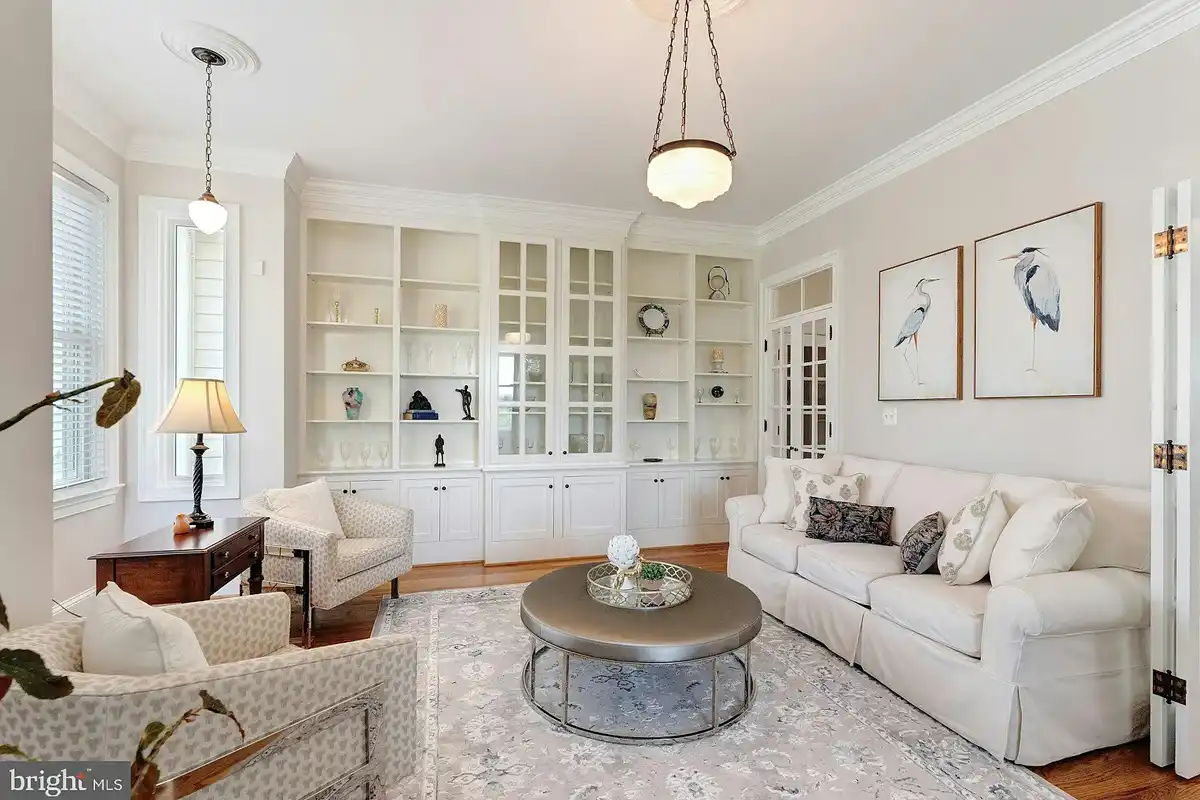 living room with white built-in shelves