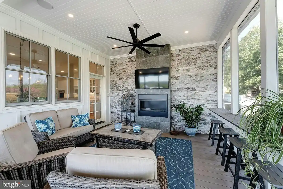 screened-in porch with fireplace
